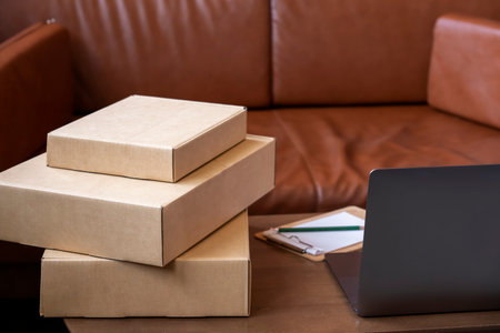 Cardboard box package for delivery in living room.の写真素材