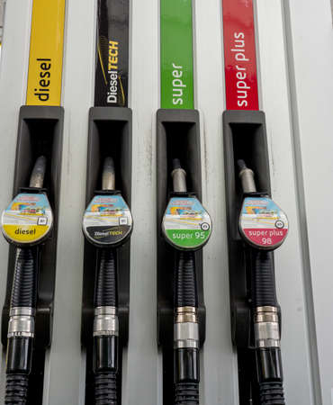 Wolfgang, Austria Sep,9,2019 : Red green yellow black color fuel gasoline dispenser background. Stock Market and Transportation and ownership business concept.のeditorial素材