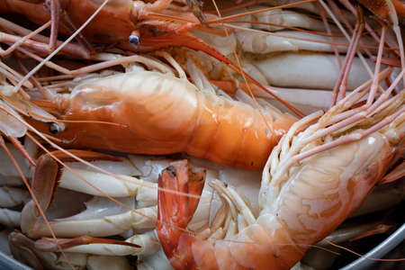 Closeup Seafood platter lunch in Thailand Summer vacation overhead shot. Cooked  crab prawns on ice...