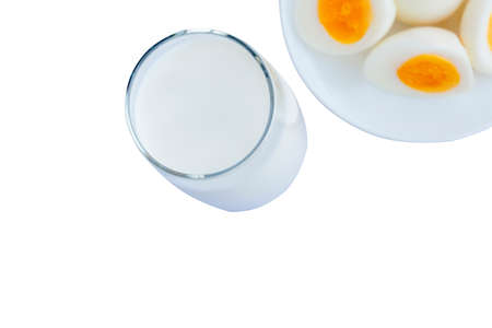 Glass of milk with boiled eggs isolated on white background. Dairy free milk substitute drink, diet...