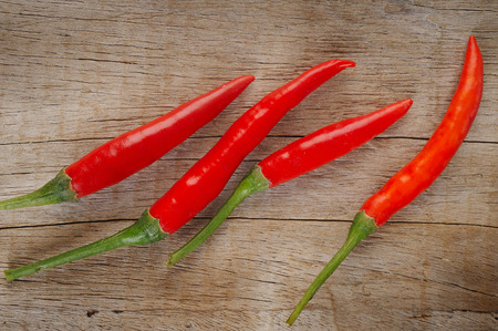 Red pepper on wooden backgroundの写真素材