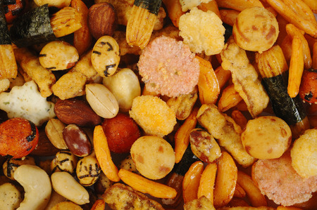mix nuts and rice crackers backgroundの写真素材