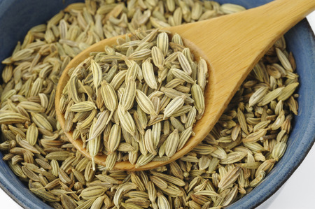 Fennel seeds in wooden spoonの写真素材