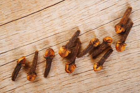 Cloves herb on wooden backgroundの写真素材