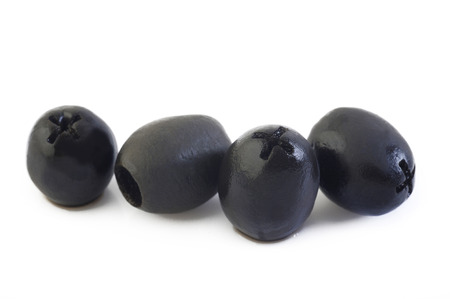 black olives isolated on white backgroundの写真素材