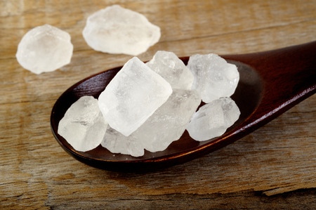 rock sugar in wooden spoonの写真素材