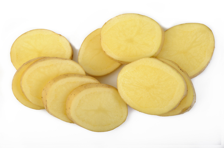 Fresh sliced potatoes on white backgroundの写真素材