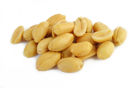 Peeled salted peanuts isolated on white background