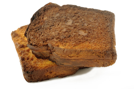 Burnt toast isolated on white backgroundの写真素材