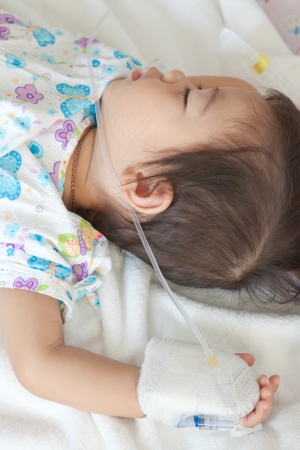 little boy patient sleeping in hospitalの写真素材