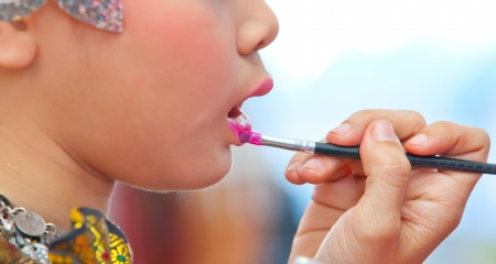 Close up of beautician creating makeup for a young womenのeditorial素材