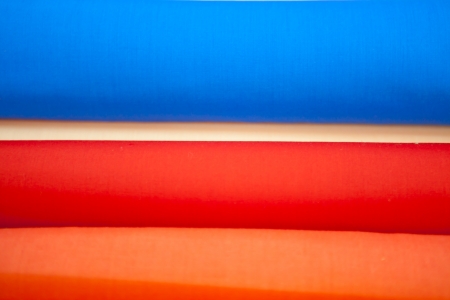Rolls of multicoloured satin textilesの写真素材