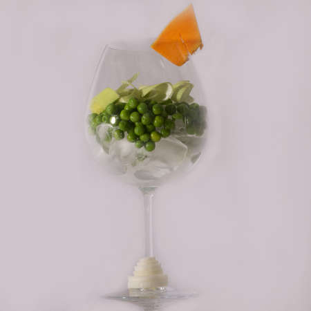 Leeks and peas on the ice in a glassの写真素材