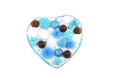 composition of flowers in the form of a heart with chocolateの写真素材