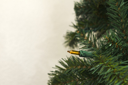 Artificial Chrismas Tree Against Wallの写真素材