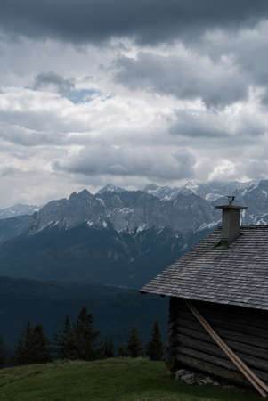part of a hunting lodge with the wettterstein in the backgroundの写真素材