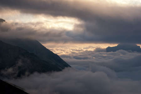 sun breaking trough the cloudsの写真素材