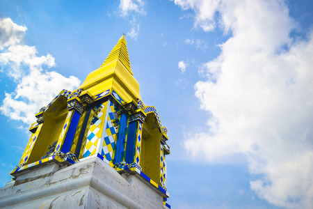 The yellow pagoda with blue skyの写真素材