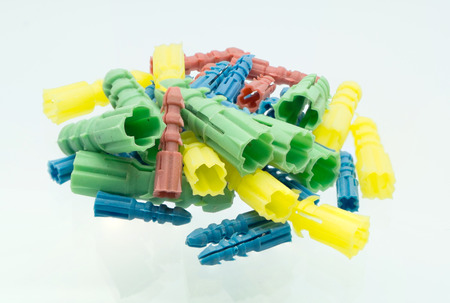 pile of plastic wall plugs color full