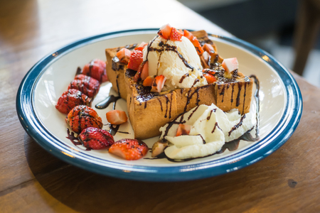 chocolate toast with strawberry and ice creamの写真素材