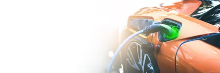 Electric orange car charge battery energy in station. Panoramic web banner on white background with...