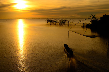 boat silhouette on lake in  Evening photograph