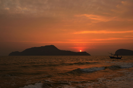 Beautiful sunset above the sea and mountainの写真素材