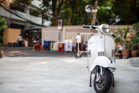 Bangkok, Thailand - February 9, 2017 : The vintage white vespa stands parked near the street at February 9, 2017 in Bangkok, Thailandのeditorial素材