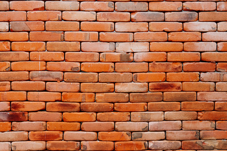 Old brown and red brick wall backgroundの写真素材