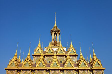 Beautiful golden roof of  the Golden Castle or Prasat Thong-kam at Wat Thasung, Uthai Thani, Thailandのeditorial素材