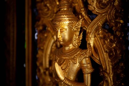 Close-up of Golden ancient thai craft art  locates in the Golden Castle or Prasat Thong-kam at Wat Thasung, Uthai Thani, Thailand (Selective focus)のeditorial素材