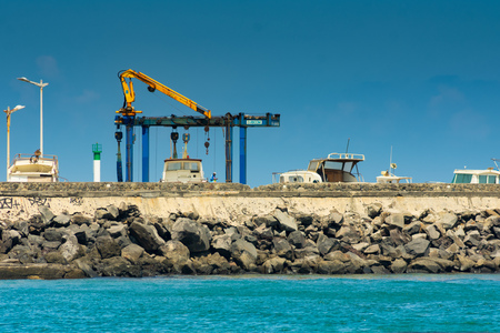 Saint-Pierre, France - September 27 2018: Sunny blue sky profile of harbor in Saint-Pierre Reunion Islandのeditorial素材