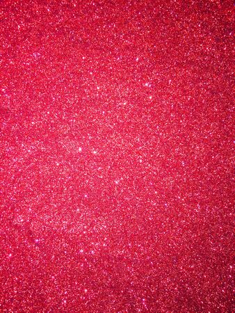 Red glitter texture and shiny sparkle Christmas abstract backgroundの写真素材