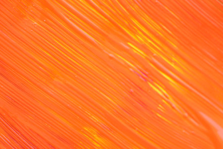 abstract orange background with some smooth lines in it (shallow DOF)の写真素材
