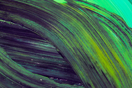 Abstract background of acrylic paint in green and black tones. Close-up.の写真素材