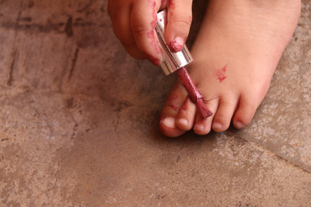 Little girl with bloody wound on her bare foot, close up viewの写真素材