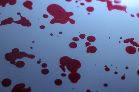 Blood splatter on a white surface. Abstract background for design.の写真素材