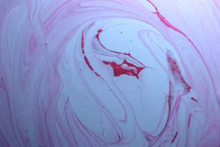 Abstract background of acrylic paint in blue and pink tones. Liquid marble texture.
