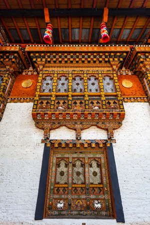 Ornate facade with window of the Punakha dzong monastery in Punakha, Bhutan, Asiaの写真素材