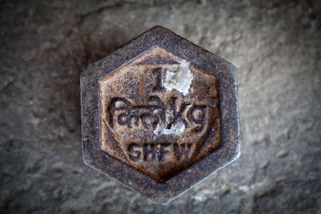 Iron 1 kilogram weight in Bhutan (with the following text Bhutanese: kilogram and kg) in Southeast Bhutan, Asiaの写真素材