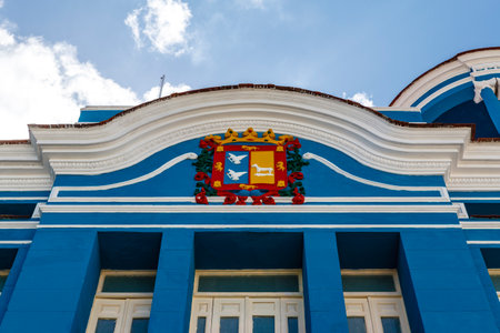 Old colonial blue building with the coat of arms of Camaguay, Cuba, North Americaの写真素材
