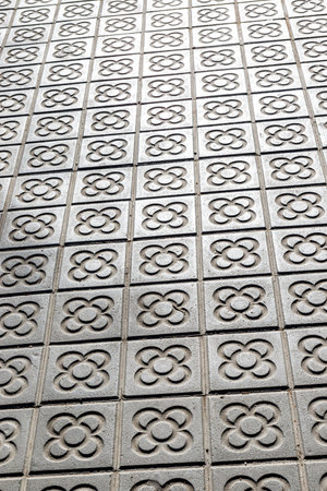 Sidewalk with panot (tiles with flower inside) in Barcelona, Catalonia, Spain, Europeの写真素材