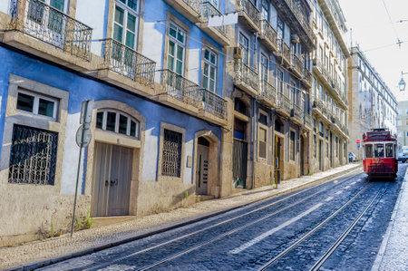 Old red tram in the historic center of Lisbon, Portugal, Europeの写真素材