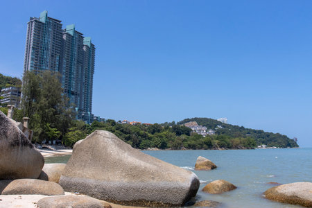 Tropical beach with boulders in Batu Ferringgi, Penang, Malaysia, Asiaの写真素材