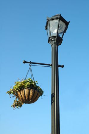 Victorian style Street light with flower basketの写真素材