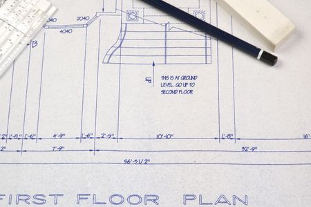 first floor plans of a house with pencil, eraser and slide rule