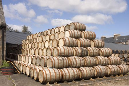 Bourbon Barrels stacked up in the yard of a Scottish distillery ready for use