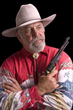 Handsome olld -boomer Cowboy dressed in black and looking like Buffalo Bill Codyの写真素材