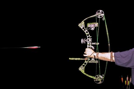 Archer shooting arrow over a black background