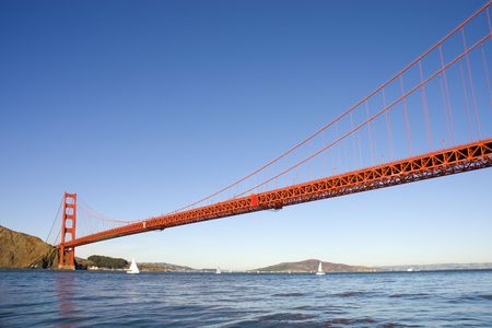 Golden gate bridge from the Pacific Ocean, with sail boats in the bay